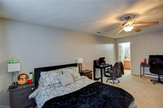 bedroom featuring light carpet, visible vents, baseboards, connected bathroom, and ceiling fan