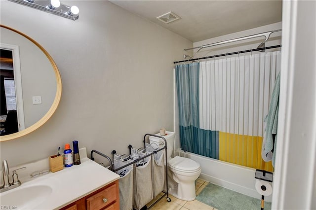 bathroom featuring tile patterned flooring, toilet, vanity, visible vents, and shower / tub combo with curtain