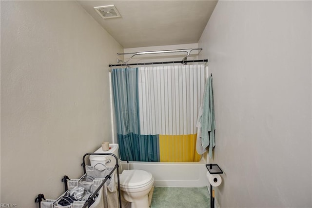 bathroom featuring toilet, visible vents, and shower / tub combo with curtain