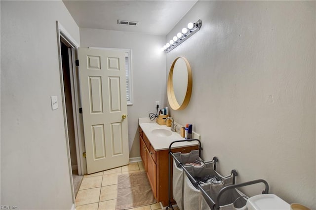 bathroom featuring tile patterned flooring, visible vents, and vanity