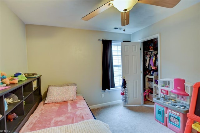 bedroom with a closet, visible vents, a ceiling fan, carpet flooring, and baseboards