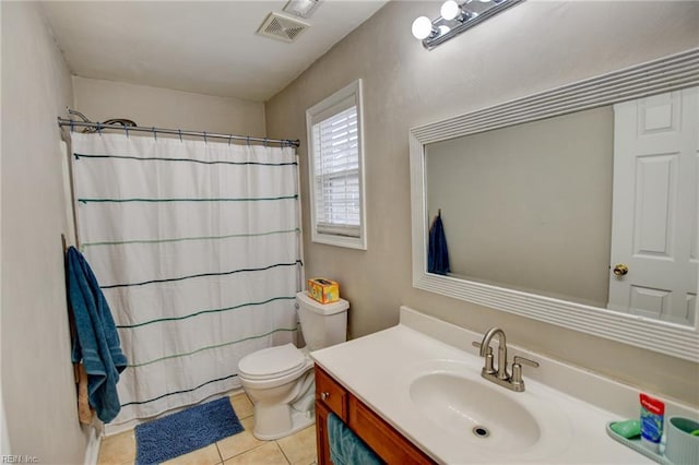 bathroom with visible vents, a shower with shower curtain, toilet, vanity, and tile patterned flooring