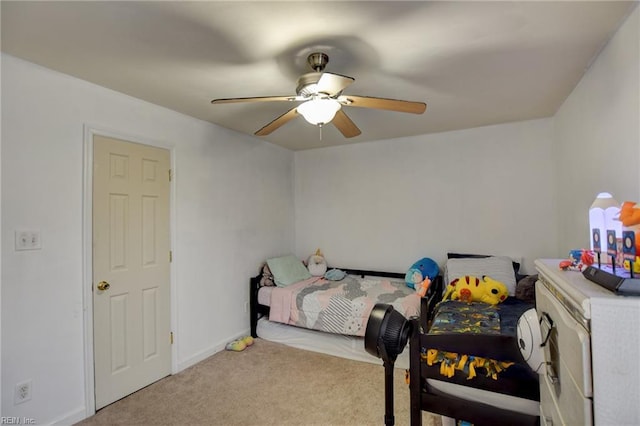 bedroom with a ceiling fan, light colored carpet, and baseboards