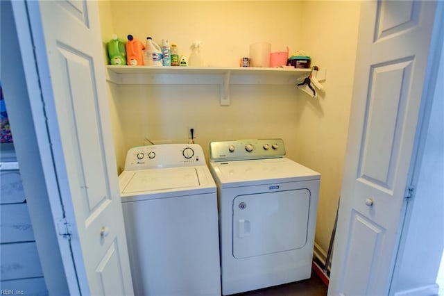 clothes washing area featuring laundry area and washer and dryer