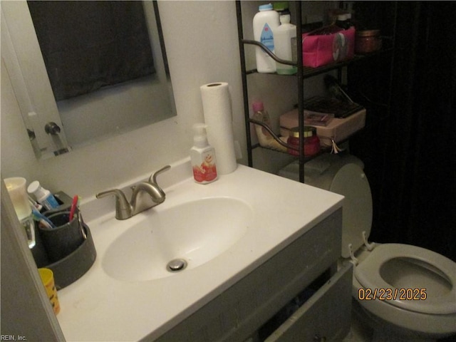 bathroom with vanity and toilet