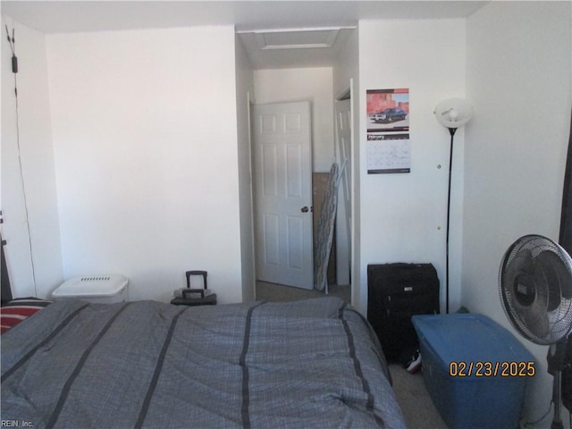 bedroom featuring attic access