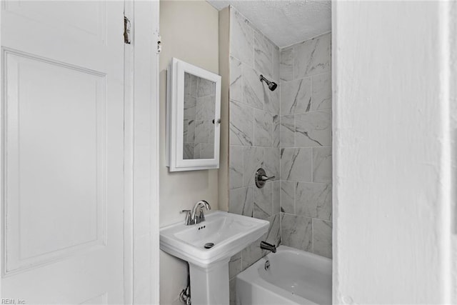 bathroom featuring a sink and shower / tub combination