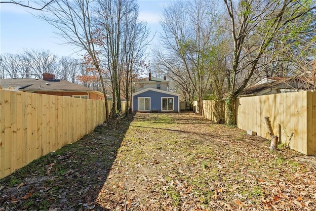 view of yard with a fenced backyard