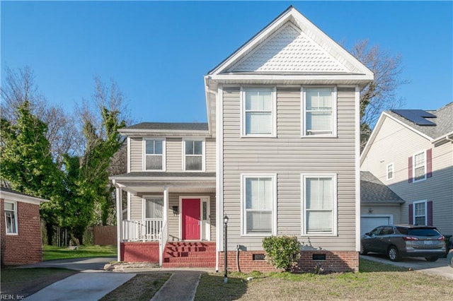 traditional-style home with covered porch, driveway, crawl space, and an attached garage