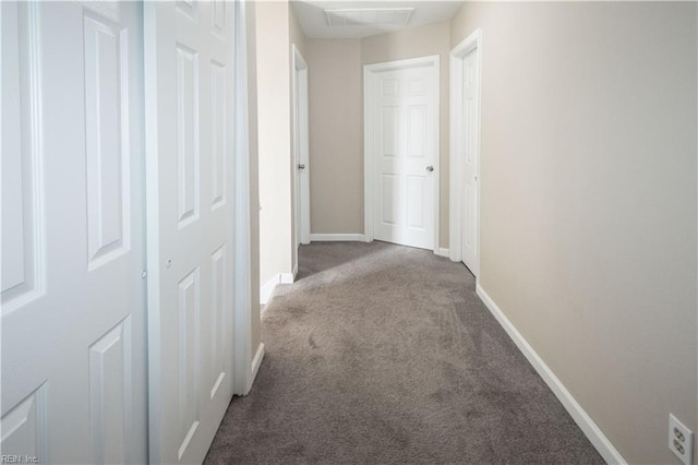 hall with carpet floors and baseboards