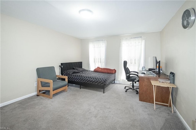 bedroom with carpet and baseboards