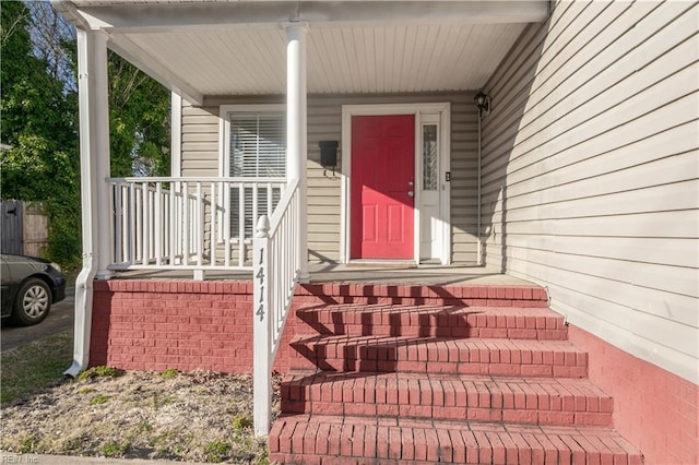 property entrance featuring covered porch