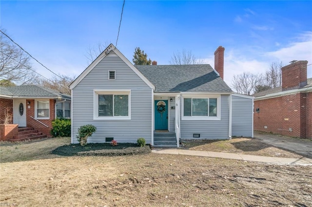 bungalow featuring crawl space, a shingled roof, and a chimney