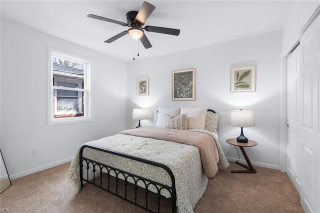 bedroom featuring a closet, carpet flooring, and baseboards