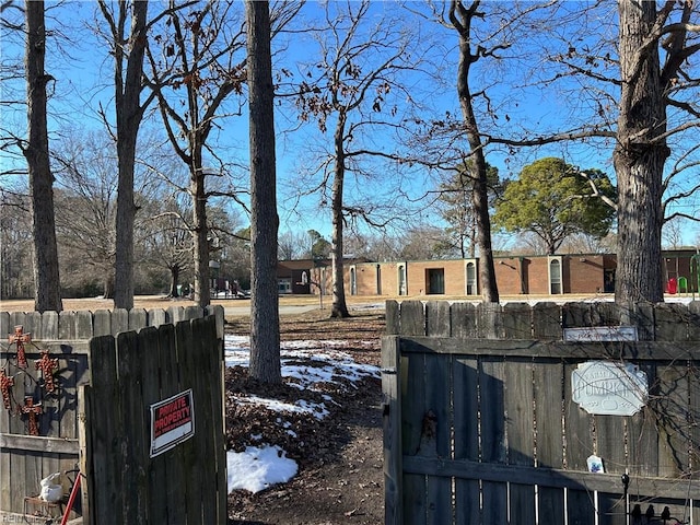 snowy yard with fence