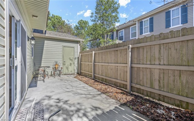 view of patio featuring fence