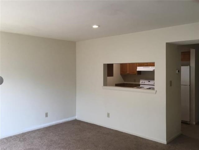 carpeted spare room with baseboards and recessed lighting