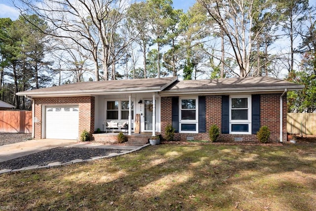 ranch-style home with an attached garage, brick siding, fence, concrete driveway, and crawl space