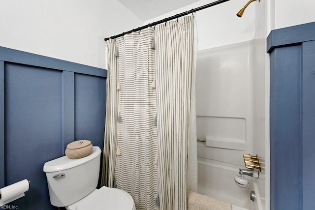 full bath featuring toilet and curtained shower