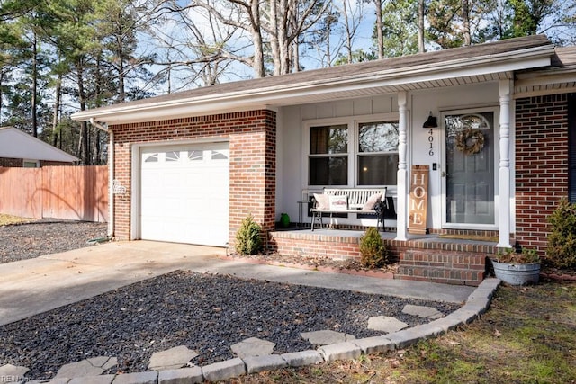 single story home featuring concrete driveway, a porch, an attached garage, and brick siding