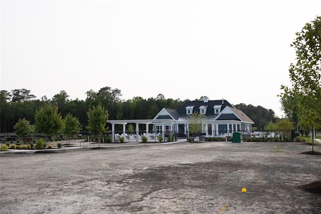 view of front of house featuring fence