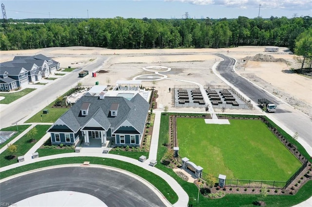 bird's eye view featuring a wooded view