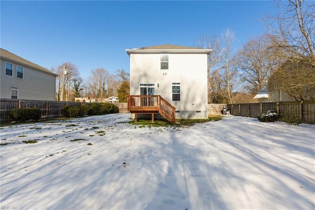 snow covered property featuring crawl space, a fenced backyard, a deck, and stairs