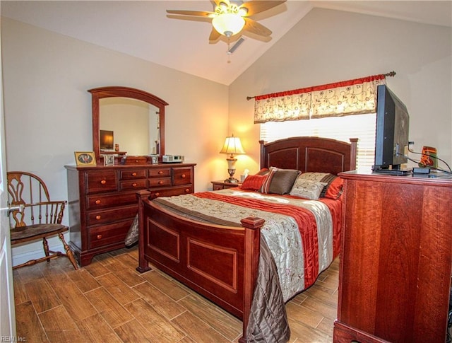 bedroom with ceiling fan, wood tiled floor, and vaulted ceiling