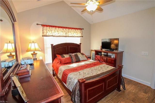 bedroom featuring baseboards, vaulted ceiling, and wood finished floors