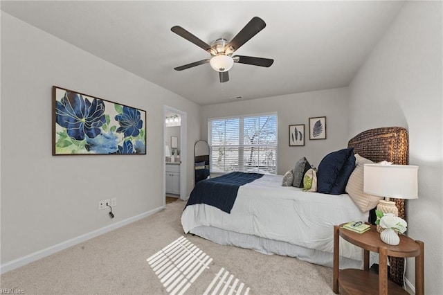 bedroom with visible vents, baseboards, connected bathroom, light colored carpet, and ceiling fan