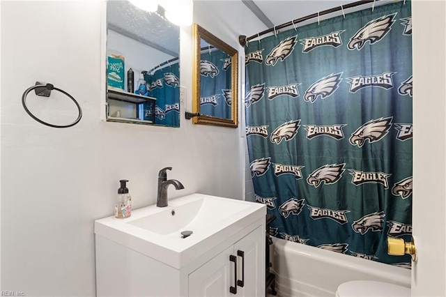 full bathroom featuring toilet, shower / bath combination with curtain, and vanity