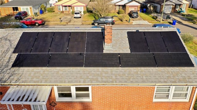 birds eye view of property with a residential view