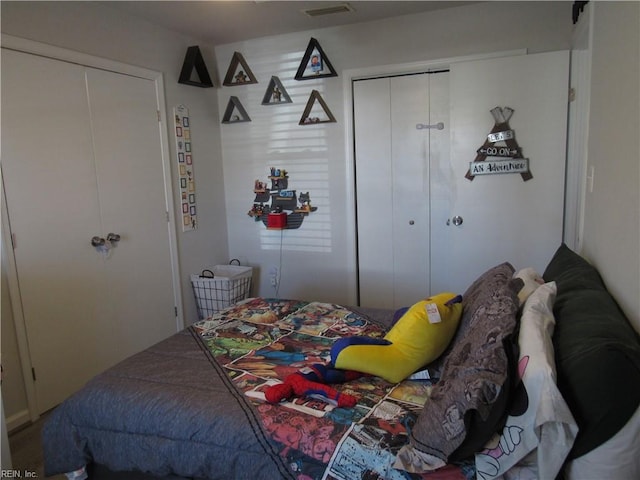 bedroom with a closet and visible vents