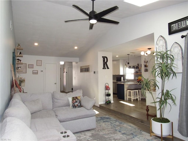 living area with ceiling fan, lofted ceiling, recessed lighting, visible vents, and dark wood-style floors