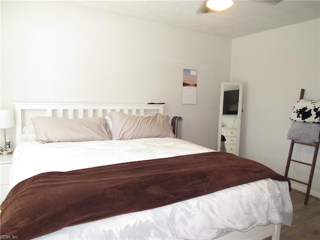 bedroom with wood finished floors