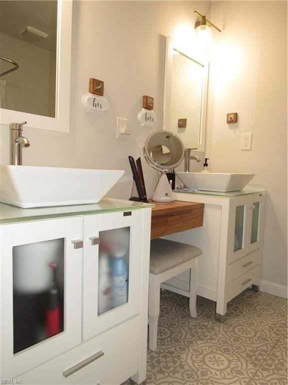 bathroom featuring tile patterned flooring and vanity