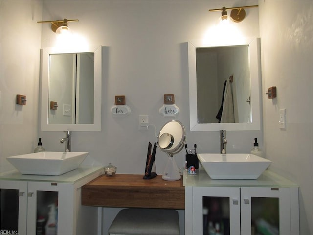 bathroom with double vanity and a sink