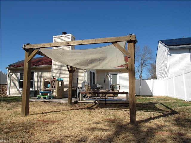 rear view of property with a patio area, a fenced backyard, and a yard