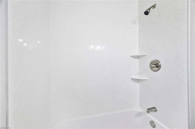 interior details with bathing tub / shower combination