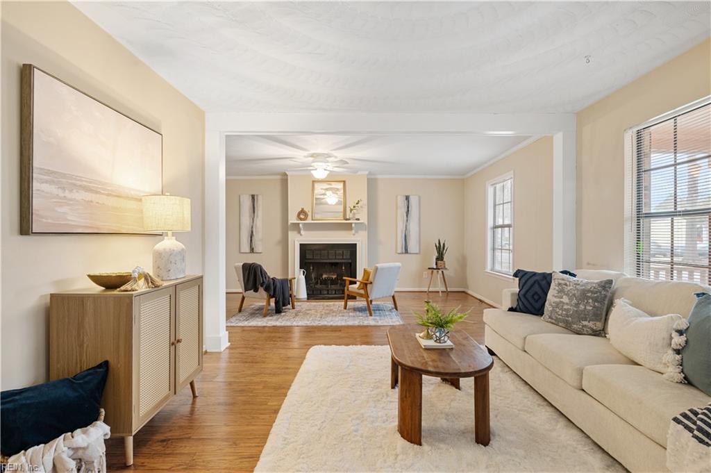 6820 Cedarwood Ct, Norfolk, VA 23513 - living room featuring light wood-type flooring, plenty of natural light, a fireplace, and baseboards