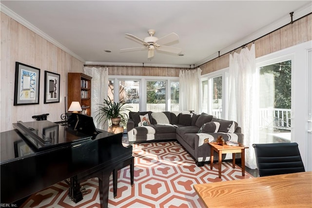 interior space featuring ornamental molding and ceiling fan