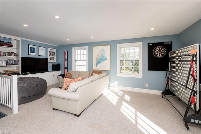 carpeted living room featuring recessed lighting, plenty of natural light, and baseboards