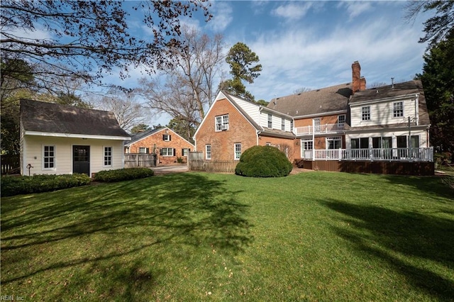 back of house featuring fence and a yard