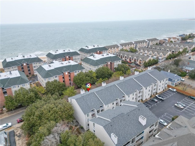 birds eye view of property with a water view and a residential view