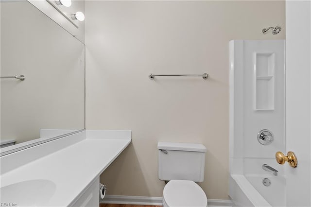 full bathroom featuring shower / washtub combination, vanity, toilet, and baseboards