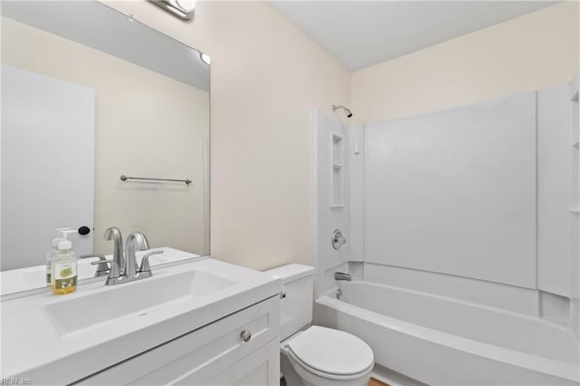 full bathroom featuring toilet, vanity, and bathing tub / shower combination