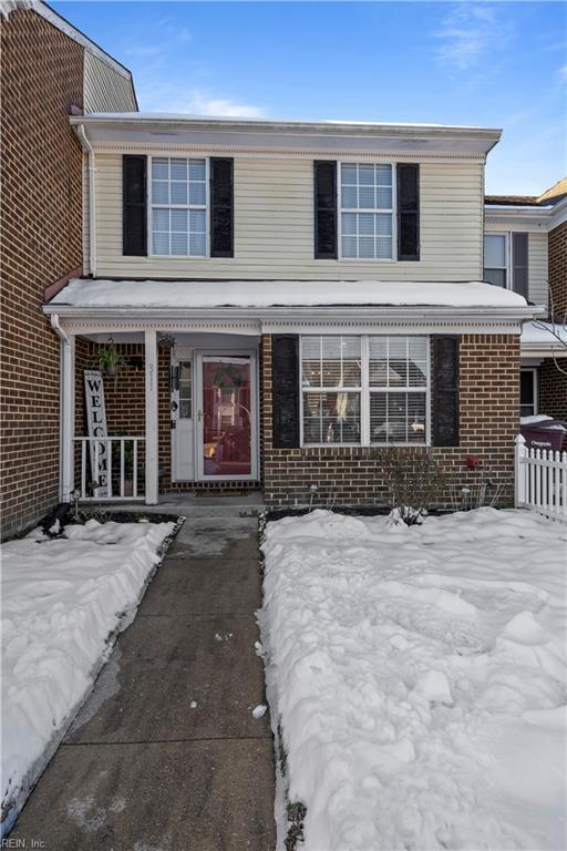 traditional home with brick siding