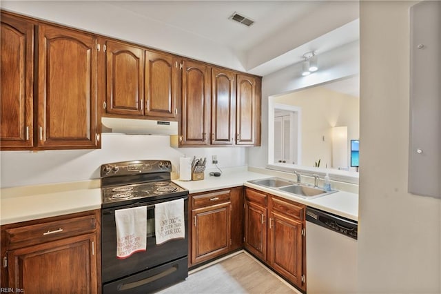 kitchen featuring dishwasher, light countertops, black electric range, under cabinet range hood, and a sink