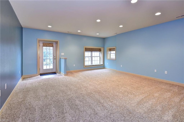 4665 Westhampton, Williamsburg, VA 23188 - empty room featuring light carpet, a healthy amount of sunlight, baseboards, and recessed lighting