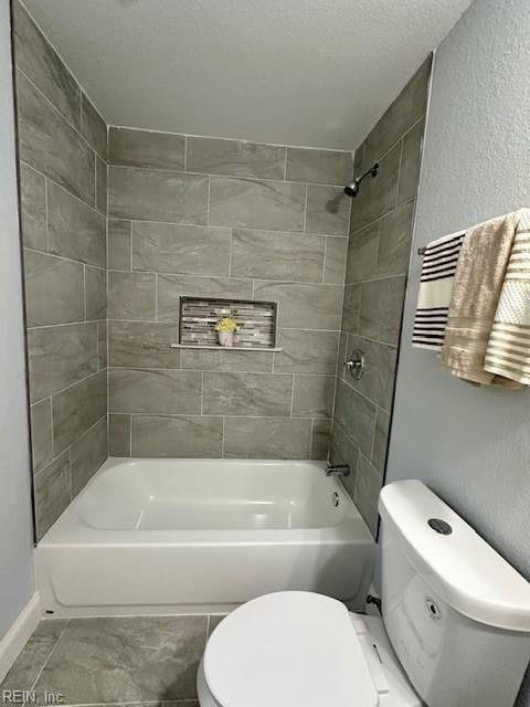 bathroom with toilet, a textured wall, a textured ceiling, and shower / bathtub combination